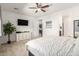 Bright main bedroom features a ceiling fan, carpeted floors, and white walls at 3415 S 75Th Dr, Phoenix, AZ 85043