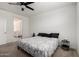 Primary bedroom featuring a ceiling fan, carpet, and window with blinds at 40380 W Jenna Ln, Maricopa, AZ 85138