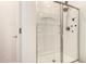 Modern bathroom shower with glass door and multiple shower heads at 40380 W Jenna Ln, Maricopa, AZ 85138