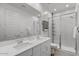 Elegant bathroom with a double vanity, a large mirror, and a glass-enclosed shower at 4157 E Pinto Dr, Gilbert, AZ 85296