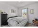 Charming bedroom with a queen-sized bed, neutral colors, and stylish decor at 4157 E Pinto Dr, Gilbert, AZ 85296