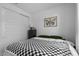 Comfortable bedroom with dark wood furniture and a cozy checkered blanket at 4157 E Pinto Dr, Gilbert, AZ 85296