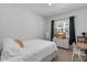 Cozy bedroom with a comfortable bed, a large window, and a modern desk at 4157 E Pinto Dr, Gilbert, AZ 85296