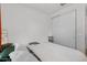 Minimalist bedroom with white walls, closet doors, neutral bedding and modern decor at 4157 E Pinto Dr, Gilbert, AZ 85296