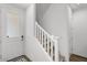 Inviting entryway featuring a staircase, modern door, and neutral tones at 4157 E Pinto Dr, Gilbert, AZ 85296