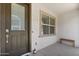 Cozy front porch with a bench, and view of the front door at 4157 E Pinto Dr, Gilbert, AZ 85296