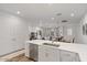 Bright kitchen with white cabinets, stainless appliances, and seamless access to the living area at 4157 E Pinto Dr, Gilbert, AZ 85296