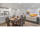 Open floor plan combining a modern kitchen, dining, and living area at 4157 E Pinto Dr, Gilbert, AZ 85296