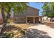 Large backyard with covered patio and stone accents, offering outdoor living space at 43670 W Mcclelland Ct, Maricopa, AZ 85138
