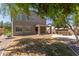 Spacious backyard with covered patio, lush lawn, and outdoor kitchen area, ideal for gatherings at 43670 W Mcclelland Ct, Maricopa, AZ 85138