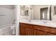Bathroom features a double sink vanity, shower over tub, and modern fixtures at 43670 W Mcclelland Ct, Maricopa, AZ 85138