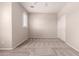 Bright bedroom with carpet flooring, a ceiling fan, and a closet with sliding doors for convenient storage at 43670 W Mcclelland Ct, Maricopa, AZ 85138