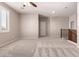 Loft area with plush carpeting, natural light and stairway access offering flexible living space at 43670 W Mcclelland Ct, Maricopa, AZ 85138
