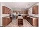 Well-appointed kitchen features stainless steel appliances, ample cabinet space, and a functional center island at 43670 W Mcclelland Ct, Maricopa, AZ 85138