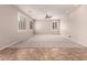 Spacious Gathering room with neutral walls, tile flooring, and natural light at 43670 W Mcclelland Ct, Maricopa, AZ 85138