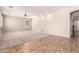 Spacious Gathering room with neutral walls, tile flooring, and natural light at 43670 W Mcclelland Ct, Maricopa, AZ 85138
