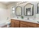 Bright bathroom boasts a double sink vanity and decorative mirrors at 4507 E Lantern Pl, Gilbert, AZ 85297