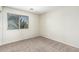 Bedroom exhibiting neutral walls, plush carpeting, and window providing plenty of natural light at 4507 E Lantern Pl, Gilbert, AZ 85297