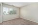 Comfortable bedroom features neutral walls, plush carpeting, and a sunlit window for relaxing at 4507 E Lantern Pl, Gilbert, AZ 85297