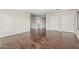 Second level bonus room with wood flooring, view to open staircase, and lots of closet space at 4507 E Lantern Pl, Gilbert, AZ 85297