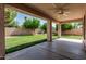 Spacious covered patio area overlooking green backyard at 4507 E Lantern Pl, Gilbert, AZ 85297