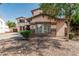 Charming home with manicured landscaping, stone accents, and neutral exterior at 4507 E Lantern Pl, Gilbert, AZ 85297