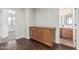Hallway features wood floors, cabinet, and entrance to a bathroom at 4507 E Lantern Pl, Gilbert, AZ 85297
