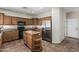 Kitchen with stainless steel refrigerator, oak cabinets, and tile floors at 4507 E Lantern Pl, Gilbert, AZ 85297