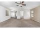 Bright living room with carpet flooring, neutral paint and open layout at 4507 E Lantern Pl, Gilbert, AZ 85297
