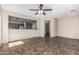 Open concept Gathering room with tile flooring, neutral colors and bar access to kitchen at 4507 E Lantern Pl, Gilbert, AZ 85297