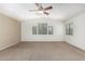 Living room featuring carpet flooring, neutral paint and natural light at 4507 E Lantern Pl, Gilbert, AZ 85297