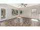 Sunlit Gathering room features tile floors, neutral walls and sliding glass door with backyard access at 4507 E Lantern Pl, Gilbert, AZ 85297