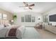 Large main bedroom with ceiling fan, neutral paint, and natural light at 4507 E Lantern Pl, Gilbert, AZ 85297
