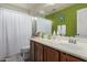 Bright bathroom featuring a vanity with ample counter space and storage at 5 N 87Th Ln, Tolleson, AZ 85353