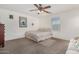 Bedroom featuring carpet, ceiling fan, and neutral colored walls at 5 N 87Th Ln, Tolleson, AZ 85353