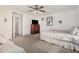 Bedroom featuring carpet, ceiling fan, and neutral colored walls at 5 N 87Th Ln, Tolleson, AZ 85353