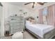 Cozy bedroom featuring a plush bed, dresser, and decorative accents at 5 N 87Th Ln, Tolleson, AZ 85353