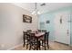 Cozy dining area featuring a wooden table, seating for six, and neutral decor at 5 N 87Th Ln, Tolleson, AZ 85353