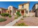 Two-story home with desert landscaping, a covered porch, and a inviting entryway at 5 N 87Th Ln, Tolleson, AZ 85353