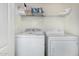 Functional laundry room with washer and dryer, providing convenience at 5 N 87Th Ln, Tolleson, AZ 85353