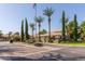 Well-maintained community features manicured landscaping, lush palm trees, and clear signage at 5335 E Shea Blvd # 2081, Scottsdale, AZ 85254