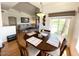 Open dining room with views into a living area and outside a large window at 5335 E Shea Blvd # 2081, Scottsdale, AZ 85254