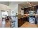 Well-appointed kitchen features stainless appliances and granite countertops at 5335 E Shea Blvd # 2081, Scottsdale, AZ 85254