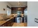 Modern kitchen showcasing stainless steel appliances and tiled flooring at 5335 E Shea Blvd # 2081, Scottsdale, AZ 85254
