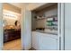 This home features a washer, dryer, and shelving in the laundry area at 5335 E Shea Blvd # 2081, Scottsdale, AZ 85254