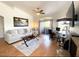 Bright living room with hardwood floors, fireplace, and balcony access at 5335 E Shea Blvd # 2081, Scottsdale, AZ 85254