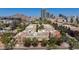 Aerial view of townhomes surrounded by lush greenery in a vibrant city neighborhood with mountain views at 581 S Roosevelt St, Tempe, AZ 85281