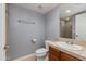 Well-kept bathroom featuring tile floors, a shower, a toilet, and a single sink vanity at 581 S Roosevelt St, Tempe, AZ 85281