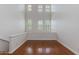 Bonus Room with hardwood floors and large windows overlooking the front yard at 581 S Roosevelt St, Tempe, AZ 85281