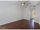 Open living room area featuring hardwood floors, a ceiling fan and a beautiful view through the door at 581 S Roosevelt St, Tempe, AZ 85281